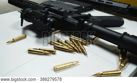 Two Rifles With Colimator Laying On The Table In Shooting Range. High Quality Photo