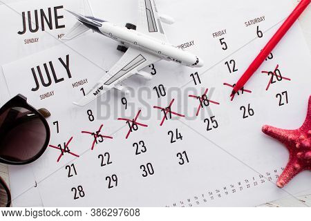 Vacation Planning Concept. Travel Preparation: Vacation Plan Written On Calendar And Sunglasses On W