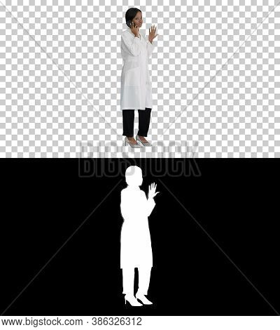 African American Female Doctor Talking On The Phone, Alpha Chann