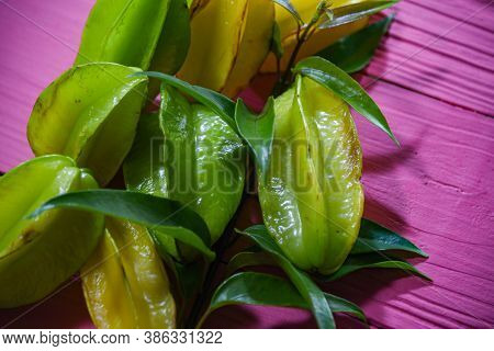 Natural Fruits Of Carambola (averrhoa Carambola) On Pink Background