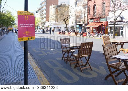 Caba, Buenos Aires / Argentina; Sept 19, 2020: Tables Set Up On The Street, Separated From Each Othe