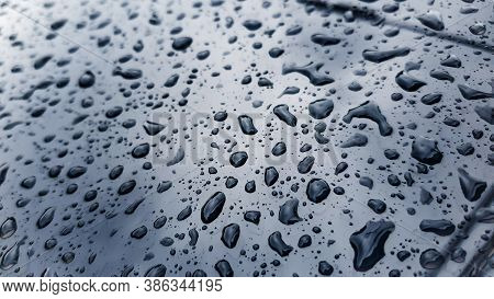 Rain Drop On The Glass Mirror Wall.