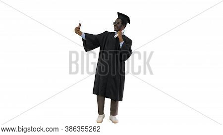 Happy African American Male Student In Graduation Robe Taking Ph
