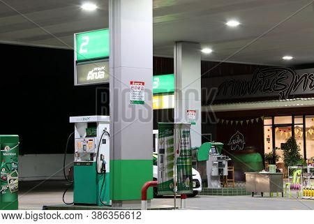 Muang, Pathumthani,thailand Apr 24, 2018: Gas Dispenser Of Pt Gas Station On The Night. Pt Is A Trad