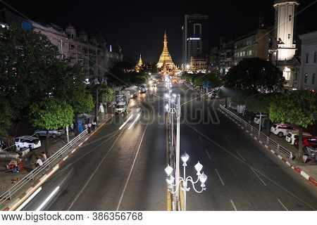 Yangon, Myanmar Feb 21, 2019: Night Time And Speed Of Light At Golden Octagon Of Sule Pagoda Located