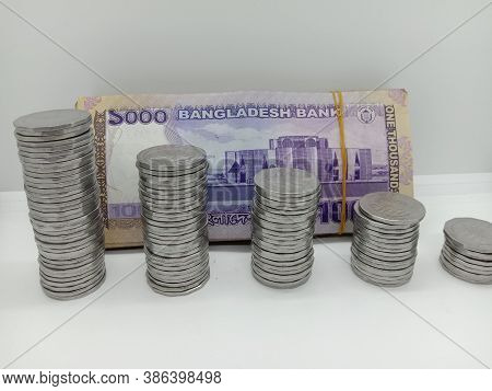 Bangladeshi Bank Note And Coin On White Background