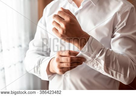 Grooms Morning Preparation, Handsome Groom Getting Dressed And Preparing For The Wedding, White Shir