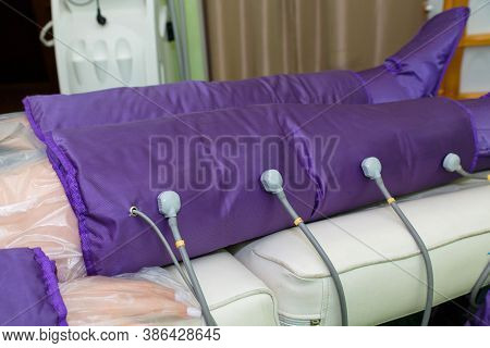 Pressotherapy In The Spa Salon For The Beauty And Health Of The Legs. A Procedure For Treating Legs 