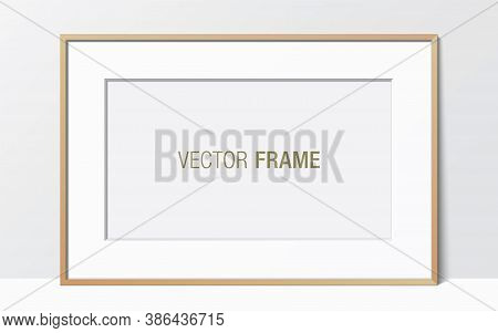 Wide Wooden Frame With Passe-partout Leaning Against The White Wall. Horizontal Blank Elegant Frame 