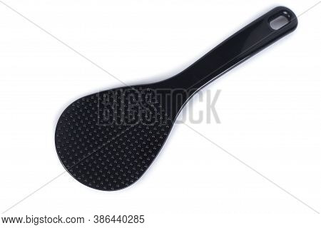 Plastic, Heat-resistant Spoon Stirrer For Multicooker. Black Spoon Isolated On White Background.