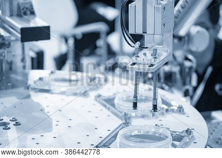 The Pneumatic Robotic Arm Picking The Product Parts In Production Line. The Hi-technology  Material 