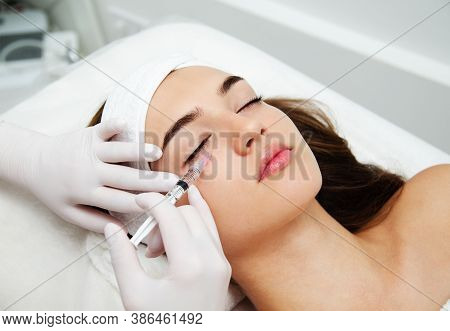 Woman Getting Cosmetic. Injection. Beauty Injections And Cosmetology.  Young Woman In Beauty Salon S