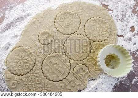 Dough Rolled Out On The Table With A New Year's Pattern. Making Cookies On The New Year's Table, A F