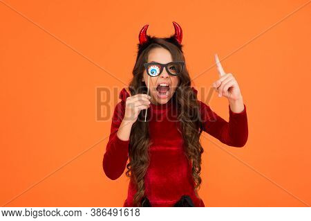 Halloween Kid In Suit And Imp Hors With Spooky Party Glasses Shouting Emotionally And Raise Finger, 