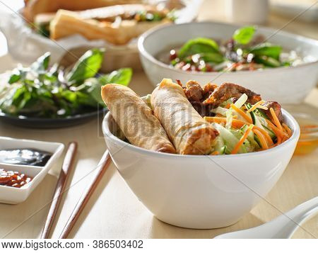 vietnamese bun thit nuong with spring rolls and grilled pork