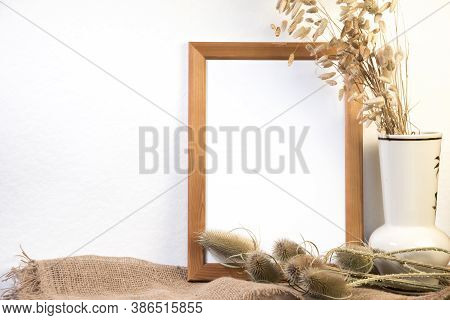 Portrait empty wooden frame mockup with yellow apples. White background. Scandinavian interior, home