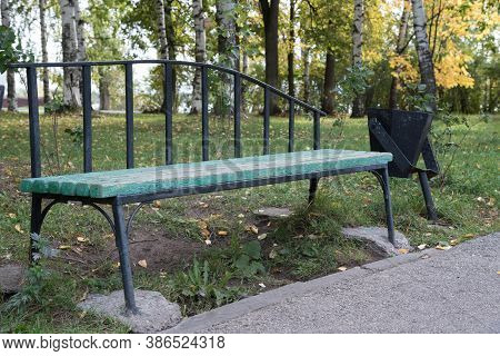 Empty Green Wooden Benches In The Autumn Park