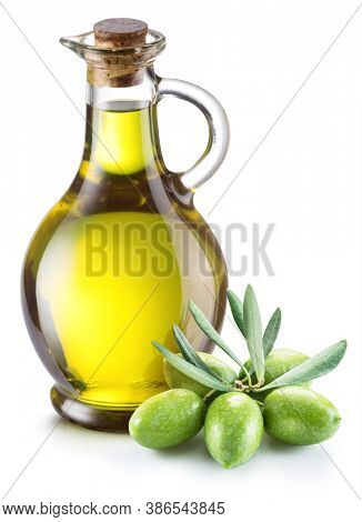 Green natural olives with bottle of olive oil isolated on a white background. 