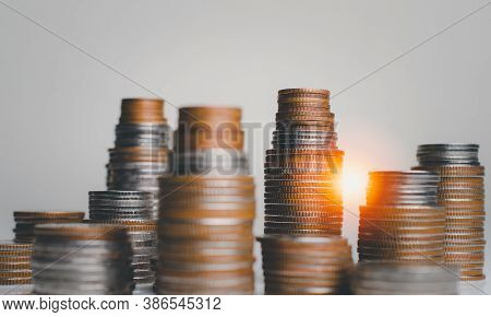 Money Coin Stack Growing Graph And House Model On Gray Background.saving Money And Investment Concep