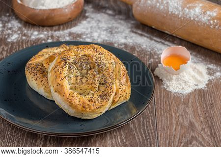 Traditional Turkish Borek Or Turkish Pastry With Minced Meat, Cheese And Spinac On Wooden Background