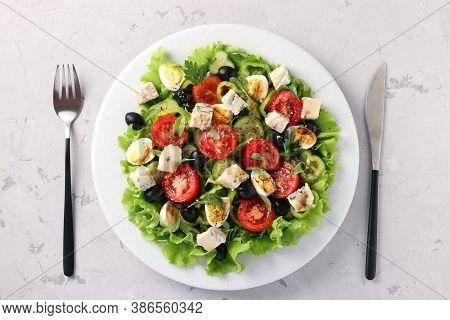 Healthy Salad Of Cherry Tomatoes, Cucumbers, Peppers, Black Olives, With Olive Oil, Quail Eggs And G