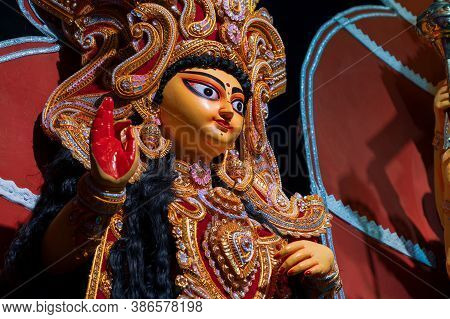 Face Of Goddess Laxmi , Durga Puja Festival At Night. Shot Under Colored Light At Howrah, West Benga