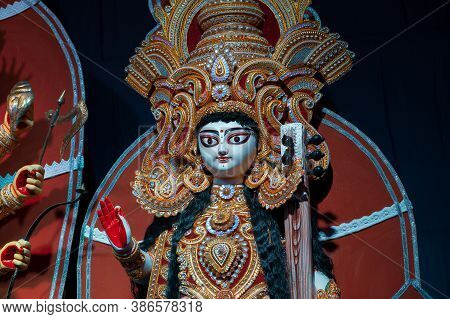 Goddess Saraswati Idol , Durga Puja Festival At Night. Shot Under Colored Light At Howrah, West Beng
