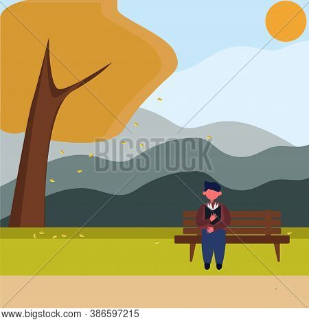 A Young Man Sits On A Bench In The Park And Reads A Book, A Man In An Autumn Park