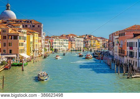 Venice Cityscape With Grand Canal Waterway. View From Scalzi Bridge. Gondolas, Boats, Yachts, Vapore