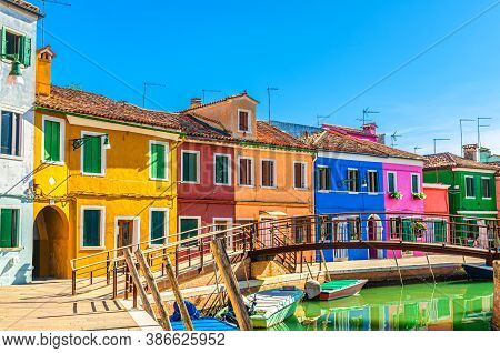 Colorful Houses Of Burano Island. Multicolored Buildings On Fondamenta Embankment Of Narrow Water Ca