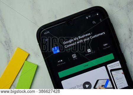 Google My Business Dev App With Magnifying On Smartphone Screen. My Business Is A Freeware Web Brows