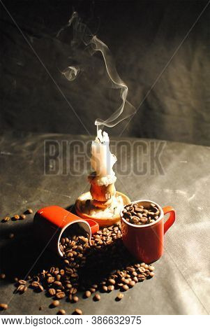 Still Life With A Candle Extinguished, Red Cups And Scattered Coffee Beans