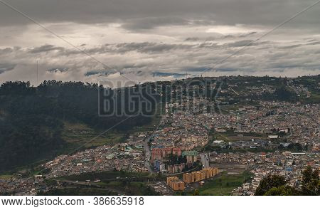 Quito, Ecuador - December 2, 2008: Seen From Cerro El Panecillo Down. Wide Cityscape With Towers And