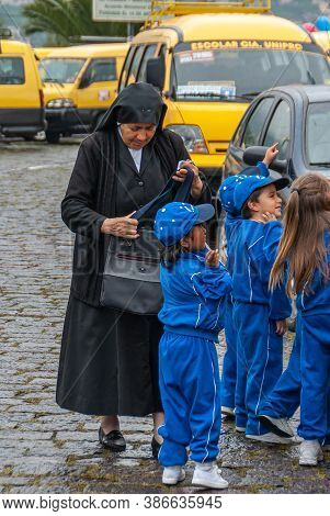 Quito, Ecuador - December 2, 2008: Cerro El Panecillo. Nun In Black With Group Of Small Schoolchildr