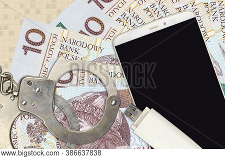 10 Polish Zloty Bills And Smartphone With Police Handcuffs. Concept Of Hackers Phishing Attacks, Ill