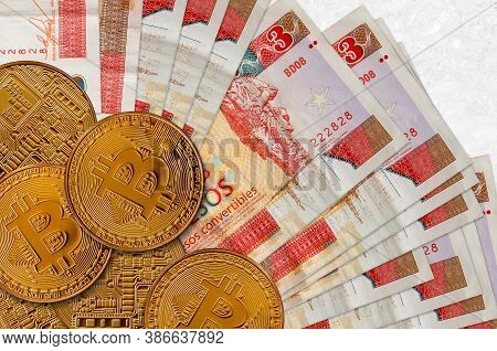 3 Cuban Pesos Convertibles Bills And Golden Bitcoins. Cryptocurrency Investment Concept. Crypto Mini