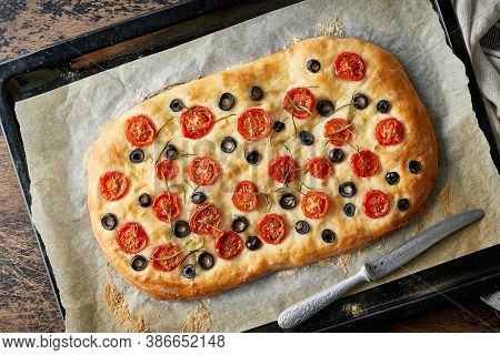 Focaccia, Pizza, Italian Flat Bread With Tomatoes, Olives And Rosemary On Tray
