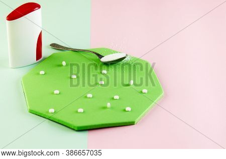 Sugar Substitute Tablets And Natural Sweetener Powder On A Green Podium. Copy Space For Text.