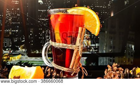 Mulled Wine Hot Christmas Drink With On A Windowsill, Next To The Window. Orange Slices, Cinnamon St