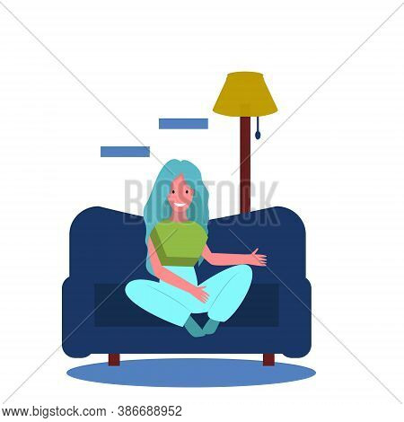 The Girl Is Sitting And Resting On The Blue Sofa At Home