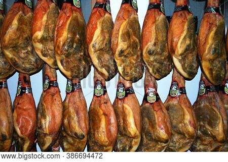 Trevelez, Spain - March 08, 2009 - Cured Legs Of Ham (jamon Serrano) Hanging In A Shop In The Villag