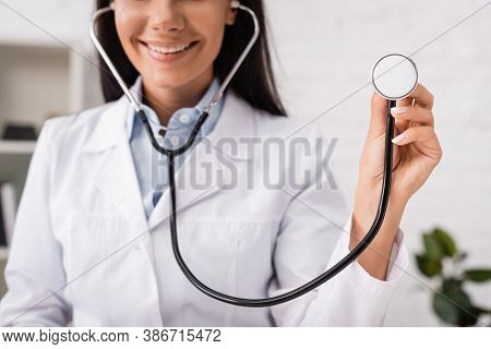 Cropped View Of Joyful Doctor Holding Stethoscope In Clinic
