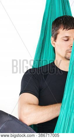 Yoga Calm Fly Pose At Hammock. Lotus Asana At Studio Training. Man Seated At Mat. Beginner Class Roo