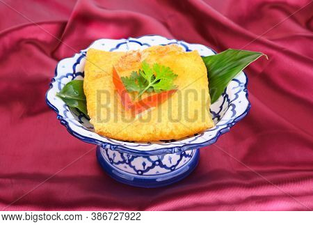 Kanom Buang Or Thai Dessert  Pancakes By Egg ,powder White Coconut Slice ,pork. On Thai Plate .thai 