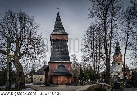 Unique 17th Century Wooden Church In Bialka Tatrzanska. Dark, Moody Storm Clouds And Dramatic Sky. T