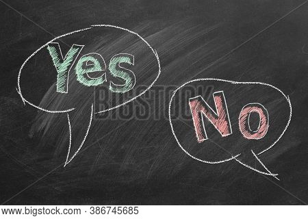Speech Bubbles With Yes And No Text Written In Chalk On A Blackboard. Different Points Of View. 2d I