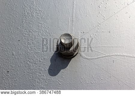 Large Head Bolt On Metal Construction As Background - Engineering Concept. Metal Head Of Bolt Mounte