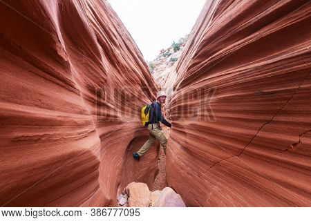 Slot canyon in Grand Staircase Escalante National park, Utah, USA. Unusual colorful sandstone formations in deserts of Utah are popular destination for hikers.