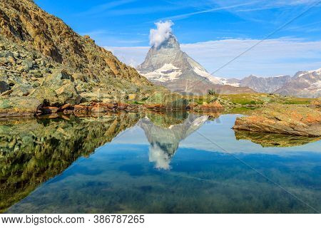 Reflection Of Mount Matterhorn On Riffelsee Lake In Zermatt, Mountain Resort In Swiss Alps, Canton O