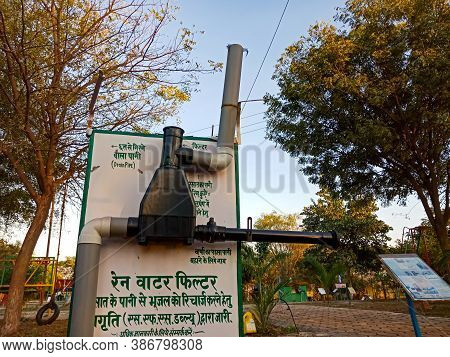 District Katni, India - January 23, 2020: An Indian Science Teacher Presenting Rain Water Filter Con